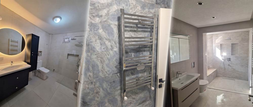 Yenilenmiş banyolar: aydınlatmalı yuvarlak ayna ve lavabo dolabı, havlupan, zemine gömme duş alanı